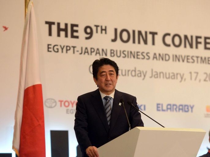 Japanese Prime Minister Shinzo Abe speaks during a business and investment conference in Cairo on January 17, 2015 as part of his official visit to Egypt. Abe pledged today $2.5 billion in non-military aid for the Middle East as he launched a regional tour that includes visits to Jordan and Israel. AFP PHOTO/MOHAMED EL-SHAHED