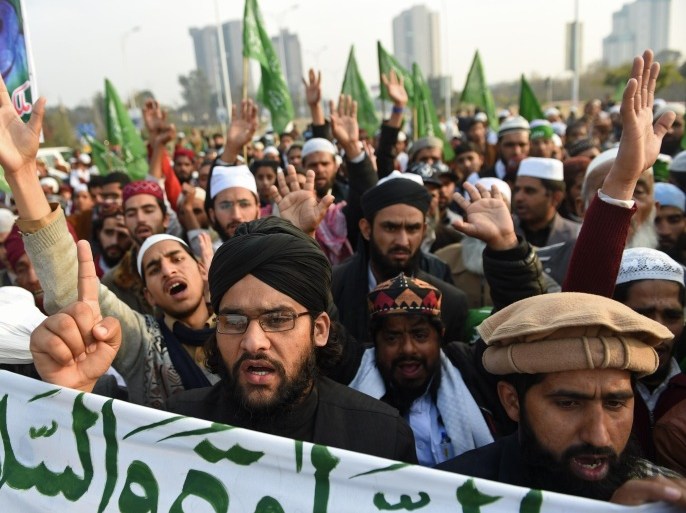 Pakistani protesters march against the printing of satirical sketches of the Prophet Muhammad by French magazine Charlie Hebdo, in Islamabad on January 18, 2015. Anti-Charlie Hebdo protests continued across Pakistan as thousands of people came on streets in almost all major cities chanting slogans against the printing of cartoons of the Prophet Mohammed in the French magazine. AFP PHOTO/Farooq NAEEM