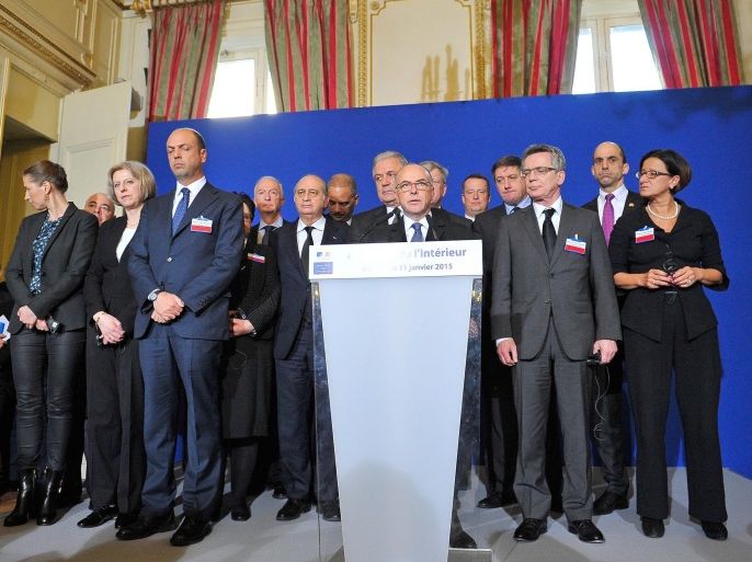 PARIS, FRANCE - JANUARY 11: Minister of Interior Bernard Cazeneuve (C) addresses the press, in the presence of the other ministers after the meeting with ministers of interior and homeland security held in the ministry of interior Place Beauvau on January 11, 2015 in Paris, France. The ministers will all join the mass unity rally held in Paris following recent terrorist attacks