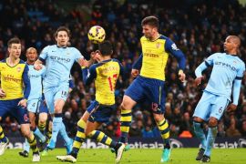 MANCHESTER, ENGLAND - JANUARY 18: Olivier Giroud of Arsenal (12) scores their second goal during the Barclays Premier League match between Manchester City and Arsenal at Etihad Stadium on January 18, 2015 in Manchester, England.