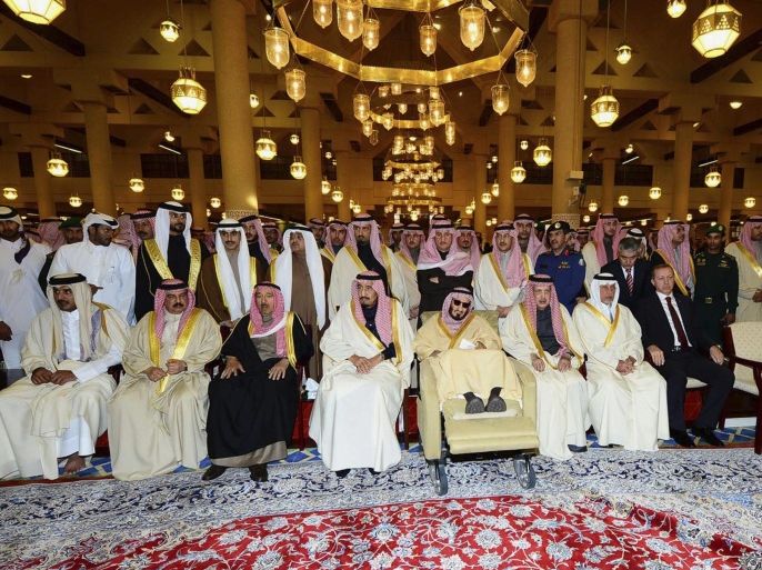 In this photo provided by the Saudi Press Agency, Saudi Arabia's newly enthroned King Salman, center, and relatives of late King Abdullah, who died early Friday, wait for his body during his funeral at the Imam Turki bin Abdullah mosque in Riyadh, Saudi Arabia, Friday, Jan. 23, 2015. Saudi state TV reported early Friday that King Abdullah died at the age of 90. (AP Photo/SPA)