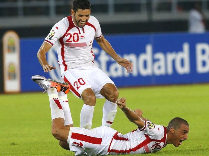 Tunisia's Ahmed Akaichi (on ground) celebrates after scoring against Equatorial Guinea in their quarter-final soccer match of the 2015 African Cup of Nations in Bata January 31, 2015. REUTERS/Mike Hutchings (EQUATORIAL GUINEA - Tags: SPORT SOCCER)