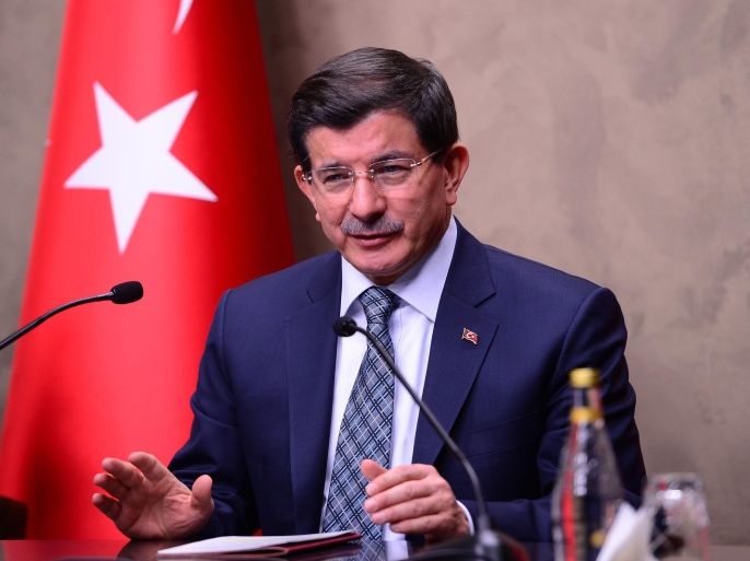 ANKARA, TURKEY - JANUARY 15: Turkish Prime Minister Ahmet Davutoglu delivers a speech during a press conference at the Esenboga International Airport in Ankara, Turkey before he leaves for Brussels on January 15, 2015.