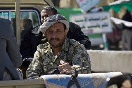 Houthi Shiite rebels ride on a pickup truck as they patrol a street in Sanaa, Yemen, Saturday, Jan. 3, 2015. Yemeni security officials say authorities in the capital, Sanaa, have arrested a Belgian, a Bulgarian and a Somali suspected of having links with al-Qaida. They added that Houthi rebels had blocked roads and deployed hundreds of gunmen in the streets of Sanaa Friday and Saturday to guard against possible suicide attacks by al-Qaida during celebrations of the Prophet Muhammad's birthday. (AP Photo/Hani Mohammed)