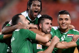 BRISBANE, AUSTRALIA - JANUARY 12: Yaser Safa Kasim of Iraq celebrates with team mates after scoring a goal during the 2015 Asian Cup match between Jordan and Iraq at Suncorp Stadium on January 12, 2015 in Brisbane, Australia.