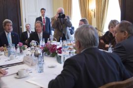 US Secretary of State John Kerry (L) talks during a meeting with Russian Foreign Minister Sergei Lavrov (R) and other members of the the Quartet on the Middle East on the third day of the 51st Munich Security Conference (MSC) in Munich, southern Germany, on February 8, 2015. The Ukraine conflict, Islamic State group jihadists and the wider 'collapse of the global order' occupy the world's security community at the annual meeting. Also on the agenda of the three-day Conference are Iran's nuclear talks, the Syrian war and mass refugee crisis, West Africa's Ebola outbreak and cyber terrorism. AFP PHOTO / POOL / JIM WATSON