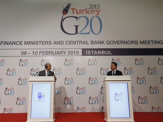 Turkey's Deputy Prime Minister Ali Babacan (R) speaks as OECD Secretary General Angel Gurria listens during a joint news conference during the G20 finance ministers and central bank governors meeting in Istanbul February 9, 2015. Turkey prefers to set specific national investment targets as part of efforts to boost economic growth but it is not clear if all G20 member nations are willing to sign up to hard numbers, Deputy Prime Minister Ali Babacan said on Monday.REUTERS/Murad Sezer (TURKEY - Tags: POLITICS BUSINESS)