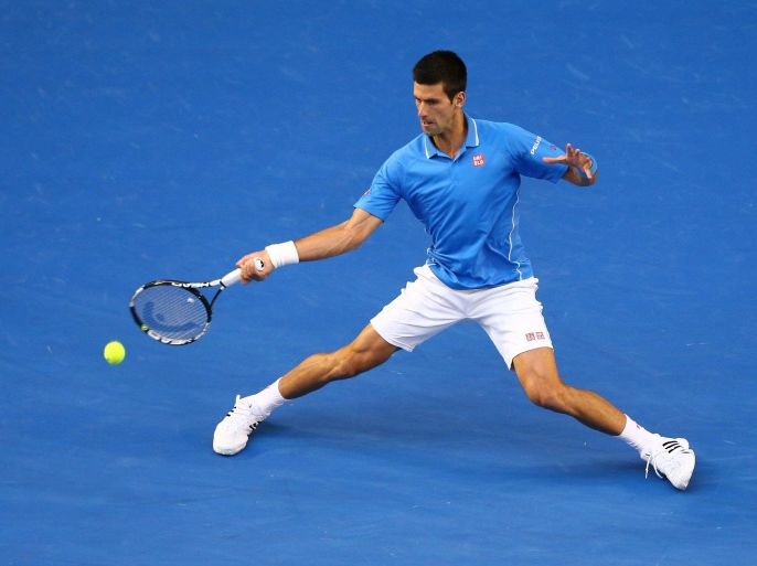 MELBOURNE, AUSTRALIA - FEBRUARY 01: Novak Djokovic of Serbia plays a forehand in his men's final match against Andy Murray of Great Britain during day 14 of the 2015 Australian Open at Melbourne Park on February 1, 2015 in Melbourne, Australia.