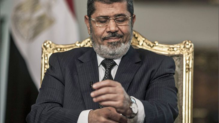 epa03995068 (FILE) A file picture dated 04 May 2013 showing the then Egyptian President Mohamed Morsi gesturing during an interview with Spanish news agency EFE, in Cairo, Egypt. An Egyptian state prosecutor said on 18 December 2013 that Morsi will face trial on charges of harming national security for conspiring with the Palestinian Hamas movement. The date for the trial is to be announced. EPA/OLIVER WEIKEN