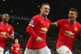 MANCHESTER, ENGLAND - FEBRUARY 28: Wayne Rooney of Manchester United celebrates scoring the opening goal with Marcos Rojo and Ashley Young of Manchester United during the Barclays Premier League match between Manchester United and Sunderland at Old Trafford on February 28, 2015 in Manchester, England.