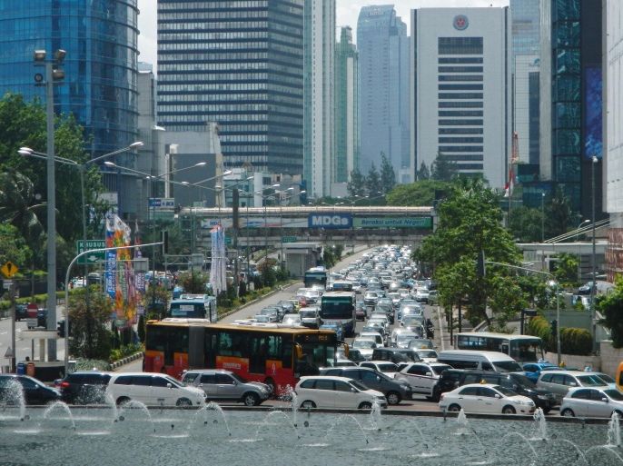 Motorists commute on a busy road in Jakarta on December 17, 2014. Jakarta encounters a range of urban issues such as traffic, with more than 3 million cars daily entering the largest metropolitan city in Southeast Asia, according to the police. AFP PHOTO / Bay ISMOYO