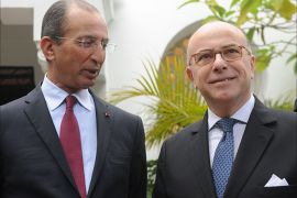 French Interior Minister Bernard Cazeneuve (R) stands next to his Moroccan counterpart Mohamed Hassad as they arrive for a meeting at the interior ministry in Rabat on February 14, 2015. Cazeneuve is on an official visit to Morocco. AFP PHOTO / STR