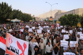 Protesters march during an anti-Houthi demonstration in Sanaa, Yemen, Wednesday, Feb. 25, 2015. Arabic writing on a banner at bottom left that reads,"no to the coup." and the other banners read "yes to legitimacy, no to the coup." A group of oil-rich Arab Gulf countries threw their support behind Yemen's embattled president Wednesday as the group's chief visited Abed Rabbo Mansour Hadi in a southern port city he fled to amid the Shiite rebel power grab in the capital, Sanaa. (AP Photo/Nadia Abdullah)