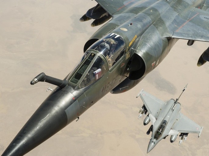 This photo taken Feb. 4, 2013, and released on Feb. 7, 2013, by the French Army Communications Audiovisual office (ECPAD) shows a Mirage F1CR (top) and a Rafale jetfighters flying over Mali. Troops from France and Chad moved into Kidal in an effort to secure the strategic north Malian city, a French official said Tuesday, as the international force put further pressure on the Islamic extremists to push them out of their last major bastion of control in the north.