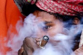 A sadhu, or holy man, smokes marijuana from a clay pipe during the Hindu festival Maha Shivaratri at the Doleshwor Temple in Kathmandu, Nepal, 17 February 2015. Hundreds of Hindu devotees including sadhus from across the country and neighboring India arrives Nepal to celebrate the birthday of Lord Shiva, the god of creation and destruction. Hindus mark the Maha Shivratri festival by offering special prayers and fasting whereas Sadhus celebrates smoking marijuana which they also sells to local youths.