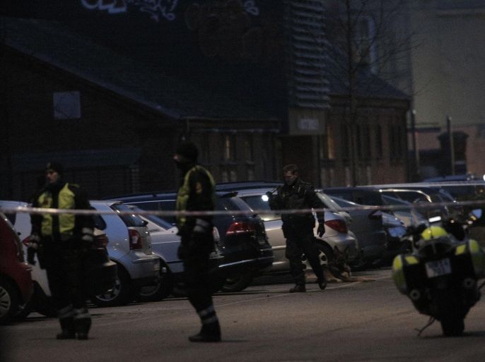 Police presence is seen at the site of a shooting in Copenhagen February 14, 2015. A civilian has died after shots were fired in a Copenhagen cafe at which controversial Swedish artist Lars Vilks attended a debate on art and blasphemy, the police said on Saturday. REUTERS/Martin Sylvest/Scanpix Denmark (DENMARK - Tags: CRIME LAW) ATTENTION EDITORS - DENMARK OUT. NO COMMERCIAL OR EDITORIAL SALES IN DENMARK. THIS IMAGE HAS BEEN SUPPLIED BY A THIRD PARTY. IT IS DISTRIBUTED, EXACTLY AS RECEIVED BY REUTERS, AS A SERVICE TO CLIENTS. NO COMMERCIAL SALES
