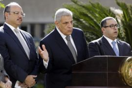 Egyptian Prime Minister Ibrahim Mahlab, second right, speaks during a press conference with Investment Minister Ashraf Soliman, right, Finance Minister Hani Qadri, second left, and Minister of International Cooperation Naglaa El-Ahwany in Cairo, Egypt, Saturday, Nov. 22, 2014. Mahlab said his government will host a three-day international economic conference in the Red Sea resort of Sharm el-Sheik starting March 13 to support the country's economy. (AP Photo/Amr Nabil)