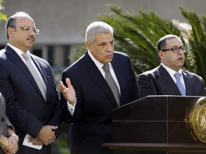 Egyptian Prime Minister Ibrahim Mahlab, second right, speaks during a press conference with Investment Minister Ashraf Soliman, right, Finance Minister Hani Qadri, second left, and Minister of International Cooperation Naglaa El-Ahwany in Cairo, Egypt, Saturday, Nov. 22, 2014. Mahlab said his government will host a three-day international economic conference in the Red Sea resort of Sharm el-Sheik starting March 13 to support the country's economy. (AP Photo/Amr Nabil)