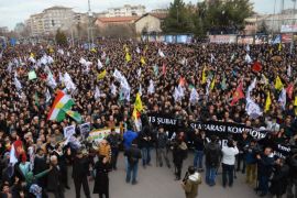 Members of the Kurdish community take part in a protest calling for the release of convicted Kurdistan Worker's Party (PKK) leader Abdullah Ocalan in Ankara on February 15, 2015. Ocalan was captured by Turkish undercover agents in Kenya in 1999, brought back to Turkey and sentenced to death. His sentence was later commuted to life. AFP PHOTO / ILYAS AKENGIN