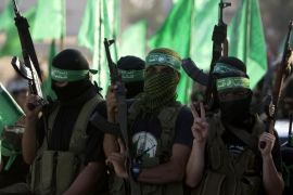 Palestinian militants from the Ezzedine al-Qassam Brigades, Hamas' armed wing, take part in a rally in Gaza City on August 27, 2014, following a deal hailed by Israel and the Islamist movement as 'victory' in the 50-day war. The agreement, effective from 1600 GMT on August 26, saw the warring sides agree to a 'permanent' ceasefire which Israel said would not be limited by time, in a move hailed by Washington, the United Nations and top world diplomats. AFP PHOTO/MAHMUD HAMS