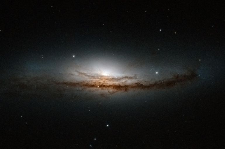The spiral galaxy NGC 5793, more than 150 million light-years away in the constellation of Libra is pictured in this undated handout image from NASA's Hubble telescope obtained by Reuters March 21, 2014. NGC 5793 is a Seyfert galaxy. These galaxies have incredibly luminous centres that are thought to be caused by hungry supermassive black holes � black holes that can be billions of times the size of the Sun � that pull in and devour gas and dust from their surroundings. REUTERS/NASA/Handout (OUTER SPACE - Tags: SCIENCE TECHNOLOGY) THIS IMAGE HAS BEEN SUPPLIED BY A THIRD PARTY. IT IS DISTRIBUTED, EXACTLY AS RECEIVED BY REUTERS, AS A SERVICE TO CLIENTS. FOR EDITORIAL USE ONLY. NOT FOR SALE FOR MARKETING OR ADVERTISING CAMPAIGNS