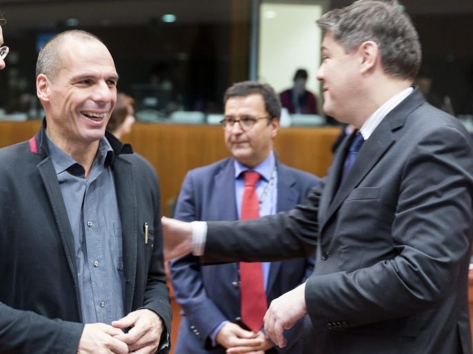 Dutch Minister of Finance, President of the Council Jeroen Dijsselbloem (L) is talking with the Greek Finance Minister Yanis Varoufakis (C) and the Croatian Minister of Finance Boris Lalovac (R) at the start of a Commission-European Investment Bank meeting at EU council headquarters, in Brussels, Belgium, 17 February 2015. Commission-EIB will discuss a partnership for jobs, growth and investment.