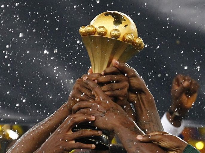 (FILES) A file picture dated 10 February 2013 of Nigerian national soccer team players celebrating with the Africa Cup trophy after winning the final against Burkina Faso at the Soccer City Stadium in Johannesburg, South Africa. Morocco will no longer host the Africa Cup of Nations early next year and its team has been disqualified, the African Football Confederation CAF said 11 November 2014. It follows CAF's decision to refuse a request from the Moroccan government to postpone the tournament early next year because of fears over Ebola. EPA/NIC BOTHMA *** Local Caption *** 50704703