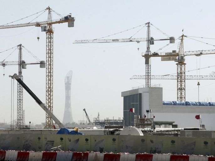 Cranes are erected at the construction site of Qatar Foundation headquarters in Doha February 21, 2013. Qatar's construction plans include a $36 billion rail system, a new airport that will cost $17.5 billion, a $7.4 billion seaport, hundreds of kilometres of major new roads, and an overall urban makeover. Many of the projects will prepare the country to host the 2022 World Cup soccer tournament, which the government hopes will seal Qatar's arrival as a top global travel destination. Picture taken February 21, 2013. To match QATAR-PROJECTS/ REUTERS/Fadi Al-Assaad (QATAR - Tags: CITYSCAPE BUSINESS)