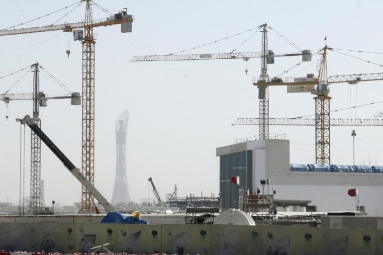 Cranes are erected at the construction site of Qatar Foundation headquarters in Doha February 21, 2013. Qatar's construction plans include a $36 billion rail system, a new airport that will cost $17.5 billion, a $7.4 billion seaport, hundreds of kilometres of major new roads, and an overall urban makeover. Many of the projects will prepare the country to host the 2022 World Cup soccer tournament, which the government hopes will seal Qatar's arrival as a top global travel destination. Picture taken February 21, 2013. To match QATAR-PROJECTS/ REUTERS/Fadi Al-Assaad (QATAR - Tags: CITYSCAPE BUSINESS)