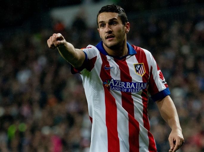 MADRID, SPAIN - JANUARY 15: Koke of Atletico de Madrid gives instructions to thier teammates during the Copa del Rey Round of 16 second leg match between Real Madrid CF and Club Atletico de Madrid at Estadio Santiago Bernabeu on January 15, 2015 in Madrid, Spain.