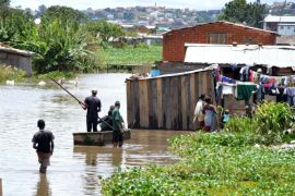 ANTANANARIVO, MADAGASCAR - JANUARY 18:People walk in water after Cyclone Chedza hits Madagascar, in Antananarivo, on January 18, 2015. Many people affected the storm and their house are destroyed.