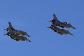 Planes belonging to the Jordanian Royal Air Force fly over the headquarters of the family clan of pilot Muath al-Kasaesbeh in the city of Karak February 4, 2015. Jordan hanged two Iraqi jihadists on Wednesday including a female militant in response to an Islamic State video showing captured Jordanian pilot Muath al-Kasaesbeh being burnt alive by the hardline group. Islamic State had demanded the release of the woman, Sajida al-Rishawi, in exchange for a Japanese hostage who it later beheaded. Sentenced to death in 2005 for her a role in a suicide bomb attack in Amman, Rishawi was executed at dawn, a security source and state television said. Jordan also executed a senior al Qaeda prisoner, Ziyad Karboli, an Iraqi man who was sentenced to death in 2008. REUTERS/Muhammad Hamed (JORDAN - Tags: POLITICS CRIME LAW CIVIL UNREST CONFLICT)