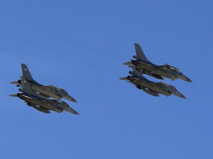 Planes belonging to the Jordanian Royal Air Force fly over the headquarters of the family clan of pilot Muath al-Kasaesbeh in the city of Karak February 4, 2015. Jordan hanged two Iraqi jihadists on Wednesday including a female militant in response to an Islamic State video showing captured Jordanian pilot Muath al-Kasaesbeh being burnt alive by the hardline group. Islamic State had demanded the release of the woman, Sajida al-Rishawi, in exchange for a Japanese hostage who it later beheaded. Sentenced to death in 2005 for her a role in a suicide bomb attack in Amman, Rishawi was executed at dawn, a security source and state television said. Jordan also executed a senior al Qaeda prisoner, Ziyad Karboli, an Iraqi man who was sentenced to death in 2008. REUTERS/Muhammad Hamed (JORDAN - Tags: POLITICS CRIME LAW CIVIL UNREST CONFLICT)
