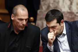 Greek Prime Minister Alexis Tsipras (R) and Finance Minister Yanis Varoufakis look on during the first round of a presidential vote at the Greek parliament in Athens, February 18, 2015. Tsipras secured enough parliamentary votes on Wednesday for his nominee to become the country's next president. The government candidate, former interior minister Prokopis Pavlopoulos, won the necessary 180 votes from lawmakers to take the largely ceremonial post.REUTERS/Alkis Konstantinidis (GREECE - Tags: POLITICS BUSINESS ELECTIONS)