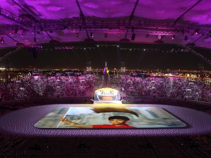 Spectators attend the opening ceremony of the pan-Arab Games at the Sheikh Khalifa stadium in the Qatari capital Doha on December 9, 2011. More than 5,000 Arab athletes are participating in the Arab games from December 9 to 24.