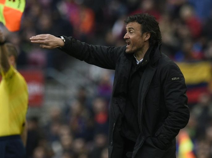 Barcelona's coach Luis Enrique gestures during the Spanish league football match FC Barcelona vs Malaga CF at the Camp Nou stadium in Barcelona on February 21, 2015. AFP PHOTO / LLUIS GENE