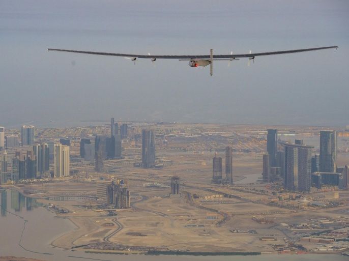 The Solar Impulse 2, a solar-powered plane, flies over the landscape of Abu Dhabi during preparations for next month's round-the-world flight, February 26, 2015. Swiss pilots Bertrand Piccard and Andre Borschberg will attempt to fly around the world in the Solar Impulse 2, in a bid to prove that such a flight is possible without the use of fossil fuels. The solar-powered plane has a wingspan of 72 metres, larger than that of a Boeing 747, but weighs only 2.3 tons, about as much as a family car. More than 17,000 solar cells on the wing power lithium-ion batteries in four electric motors. The airframe makes use of carbon fiber, which is three times lighter than paper, to keep the plane as light as possible. The 35,000 km flight is expected to take about five months, with stops in Oman, India, Myanmar, China, the United States, and in Southern Europe or North Africa depending on the weather. The Solar Impulse 2 is expected to land back in Abu Dhabi in late July or early August. REUTERS/Solar Impulse/Revillard/Rezo.ch/Handout via Reuters (UNITED ARAB EMIRATES - Tags: TRANSPORT ENVIRONMENT) ATTENTION EDITORS - THIS PICTURE WAS PROVIDED BY A THIRD PARTY. REUTERS IS UNABLE TO INDEPENDENTLY VERIFY THE AUTHENTICITY, CONTENT, LOCATION OR DATE OF THIS IMAGE. NO SALES. NO ARCHIVES. FOR EDITORIAL USE ONLY. NOT FOR SALE FOR MARKETING OR ADVERTISING CAMPAIGNS. THIS PICTURE IS DISTRIBUTED EXACTLY AS RECEIVED BY REUTERS, AS A SERVICE TO CLIENTS