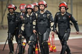 Egyptian policemen arrive at the stadium during before the Egyptian Premier League football match between Al-Ahly and Zamalek football clubs in Cairo on January 29, 2015. In Egypt's North Sinai province, where security forces are battling a raging Islamist insurgency, militants fired a barrage of rockets and set off a car bomb the same day killing at least 26 people, mostly soldiers. AFP PHOTO / MOHAMED EL-SHAHED