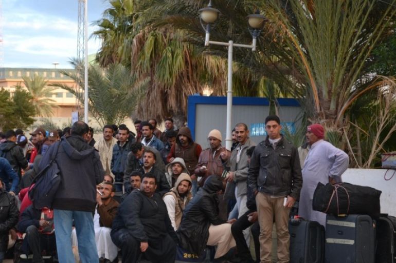 BEN GARDANE, TUNISIA - FEBRUARY 22: Egyptians waiting buses at Ras Ejdir border crossing point to go Djerba Airport for arriving Egypt due to security issues after Islamic State of Iraq and Levant (ISIL) militants beheaded 21 Egyptian Coptic Christians in Libya, on February 22, 2015 in Ben Gardane, Tunisia.