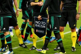 GELSENKIRCHEN, GERMANY - OCTOBER 22: Players and officials support the No to Racism action week prior to the UEFA Champions League Group E match between FC Schalke 04 and Chelsea at Veltins-Arena on October 22, 2013 in Gelsenkirchen, Germany.