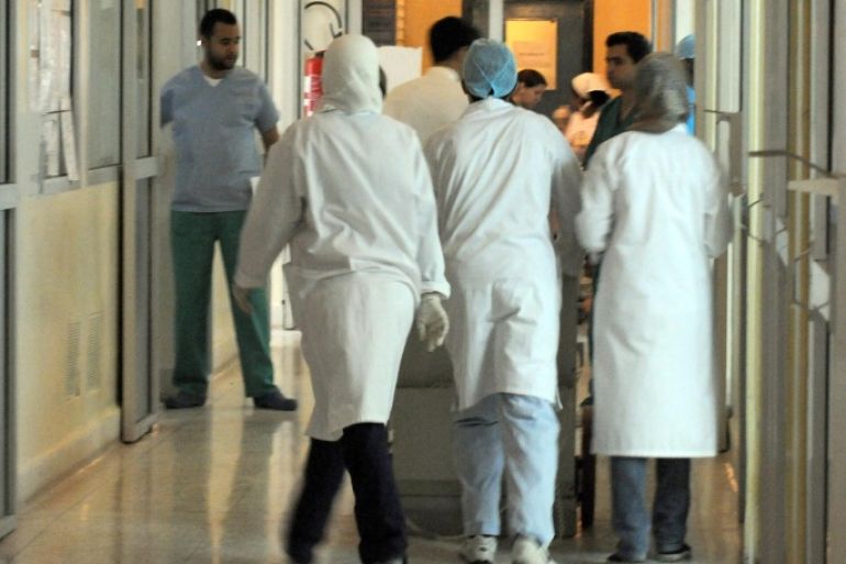 Nurses and doctors walk in a corridor of the intensive care service of the Ibn Toufail hospital, where people wounded in the bomb attack at the Argana cafe have been admitted, on April 29, 2011. At least six French citizens were among those killed in a bomb attack on a tourist cafe in Morocco and 10 more were wounded, a French government source told AFP on Friday. Earlier, Moroccan authorities had said that in all 16 people were killed in Thursday's blast, which ripped through the crowded eatery on the Jamaa el-Fna, a popular square in the historic city of Marrakesh.