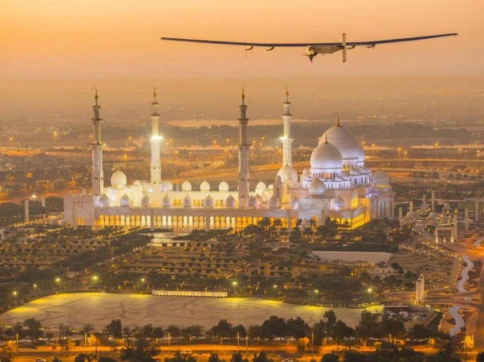 The Solar Impulse 2, a solar-powered plane, flies over the Sheikh Zayed Grand Mosque in Abu Dhabi during preparations for next month's round-the-world flight, February 26, 2015. Swiss pilots Bertrand Piccard and Andre Borschberg will attempt to fly around the world in the Solar Impulse 2, in a bid to prove that such a flight is possible without the use of fossil fuels. The solar-powered plane has a wingspan of 72 metres, larger than that of a Boeing 747, but weighs only 2.3 tons, about as much as a family car. More than 17,000 solar cells on the wing power lithium-ion batteries in four electric motors. The airframe makes use of carbon fiber, which is three times lighter than paper, to keep the plane as light as possible. The 35,000 km flight is expected to take about five months, with stops in Oman, India, Myanmar, China, the United States, and in Southern Europe or North Africa depending on the weather. The Solar Impulse 2 is expected to land back in Abu Dhabi in late July or early August. REUTERS/Solar Impulse/Revillard/Rezo.ch/Handout via Reuters (UNITED ARAB EMIRATES)ATTENTION EDITORS - THIS PICTURE WAS PROVIDED BY A THIRD PARTY. REUTERS IS UNABLE TO INDEPENDENTLY VERIFY THE AUTHENTICITY, CONTENT, LOCATION OR DATE OF THIS IMAGE. NO SALES. NO ARCHIVES. FOR EDITORIAL USE ONLY. NOT FOR SALE FOR MARKETING OR ADVERTISING CAMPAIGNS. THIS PICTURE IS DISTRIBUTED EXACTLY AS RECEIVED BY REUTERS, AS A SERVICE TO CLIENTS