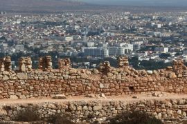 AGADIR, MOROCCO - DECEMBER 09: The city of Agadir is seen beyond the walls of the original Kasbah which was built in 1572 on December 9, 2013 in Agadir, Morocco. The Kasbah was partly restored following an earthquake in 1960 which killed more than a third of the Agadir population.