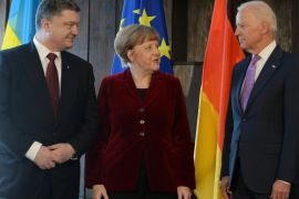 ALTERNATIVE CROP - (L-R) Ukraine's President Petro Poroshenko, German Chancellor Angela Merkel and US Vice President Joe Biden pose for photographers prior to their trilateral talks during the 51st Munich Security Conference (MSC) in Munich, southern Germany, on February 7, 2015. The Ukraine conflict, Islamic State group jihadists and the wider 'collapse of the global order' will occupy the world's security community at the annual meeting. Also on the agenda of the three-day Conference will be Iran's nuclear talks, the Syrian war and mass refugee crisis, West Africa's Ebola outbreak and cyber terrorism. AFP PHOTO / CHRISTOF STACHE