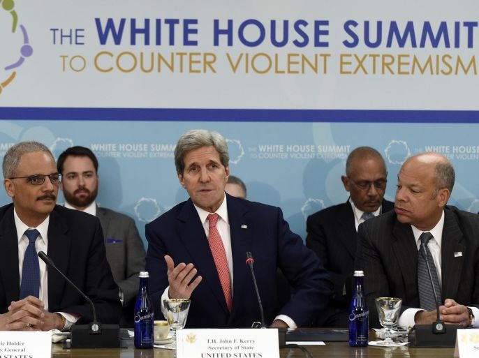 Secretary of State John Kerry, center, flanked by Attorney General Eric Holder, left, and Homeland Security Secretary Jeh Johnson, speaks at the State Department in Washington, Wednesday, Feb. 18, 2015, during the White House Summit on Countering Violent Extremism. (AP Photo/Susan Walsh)