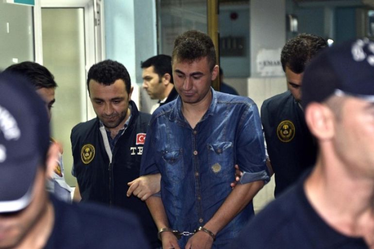 ISTANBUL, TURKEY - JULY 23: Total number of arrests in a probe into alleged wiretapping accros several police departments in different cities of Turkey has reached to 103 on July 23, 2014. Detained 3 people are taken to Haseki Training Research Hospital for medical checkup in Istanbul, Turkey on July 23, 2014.