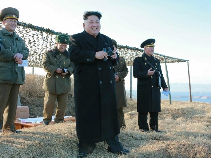 An undated handout picture released by the official North Korean Central News Agency (KCNA) on 07 February 2015 shows North Korean leader Kim Jong-un (4-L) watching the test-firing of a new anti-ship rocket at an undisclosed location. North Korean state media on 07 February reported that the new anti-ship missile will be deployed 'before long' at its naval units. EPA/KCNA/HANDOUT