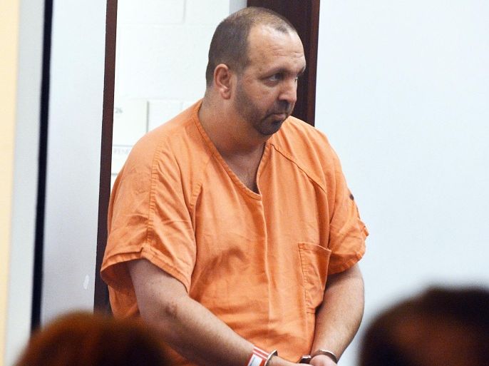 Craig Stephen Hicks, 46, enters the courtroom for his first appearance at the Durham County Detention Center on Wednesday, Feb. 11, 2015 in Durham, N.C. Hicks, 46, is accused of shooting Deah Shaddy Barakat, 23, Yusor Mohammad, 21, and Razan Mohammad Abu-Salha, 19, at a quiet condominium complex near the University of North Carolina campus. (AP Photo/The News & Observer, Chuck Liddy) MANDATORY CREDIT TV OUT