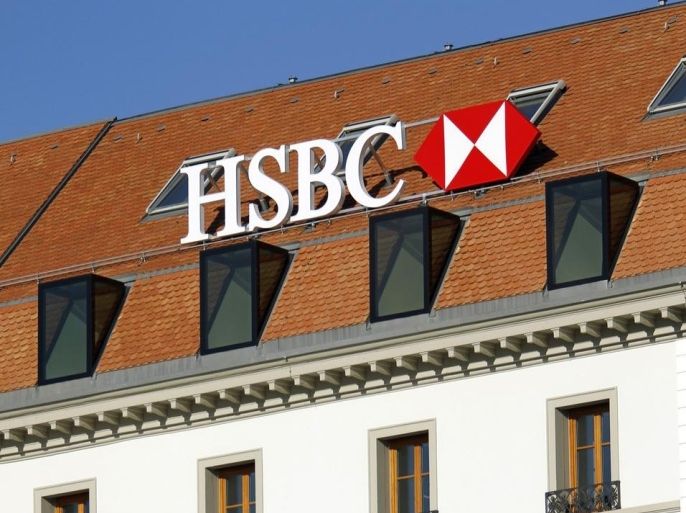 A HSBC logo is pictured at a Swiss branch of the bank, in Geneva February 9, 2015. British bank HSBC Holdings Plc admitted on February 8, 2015 failings by its Swiss subsidiary, in response to media reports it helped wealthy customers dodge taxes and conceal millions of dollars of assets. REUTERS/Pierre Albouy (SWITZERLAND - Tags: BUSINESS LOGO)