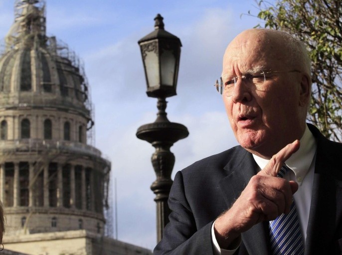 U.S. Senator Patrick Leahy, head of a U.S. delegation in the first congressional mission to Cuba since the change of policy announced by U.S. President Barack Obama on December 17, speaks to other members of the delegation in front of his hotel in downtown Havana, January 19, 2015. The U.S. will urge Cuba to lift travel restrictions on U.S. diplomats and agree to establish U.S. and Cuban embassies in historic talks in Havana this week aimed at restoring relations, a senior State Department official said on Monday. REUTERS/Stringer (CUBA - Tags: POLITICS)